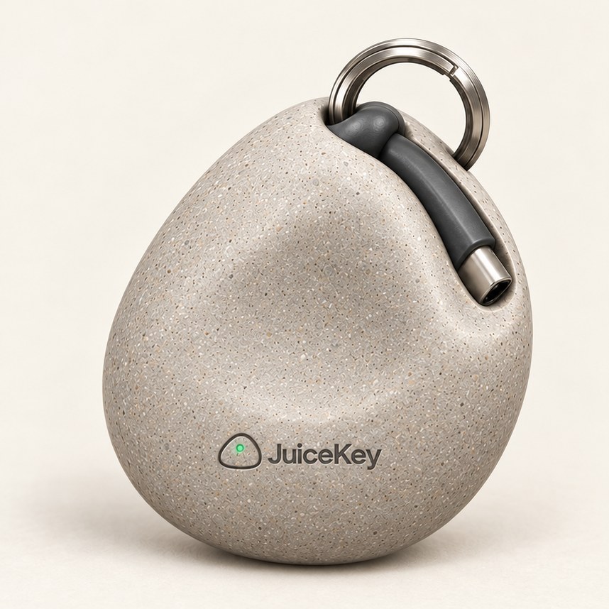 JuiceKey concept in stone-look finish with a subtle thumb contour and the USB-C cable tucked into its groove